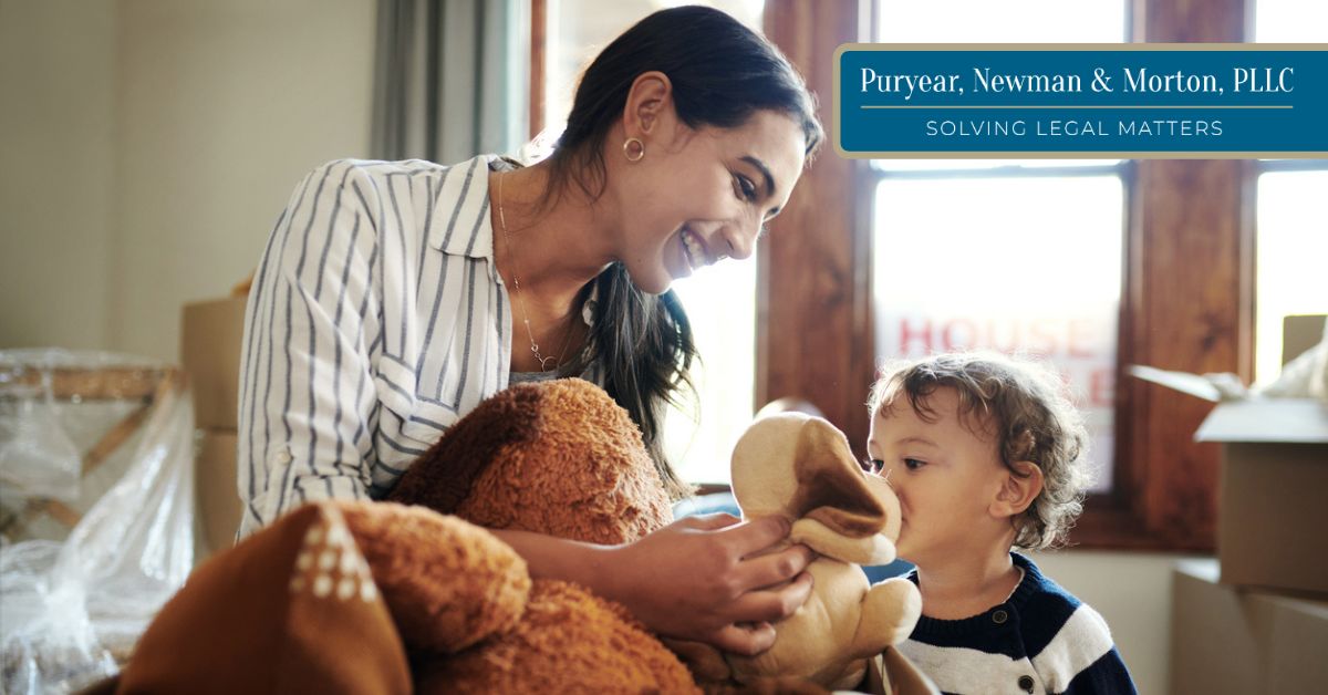 Mother and son packing up items from their house
